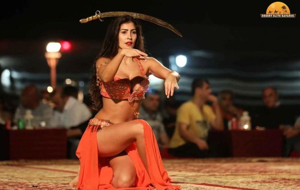 Camel ride at sunset during Dubai desert safari belly dancing show tour